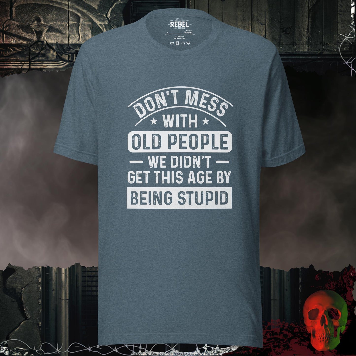 T-shirt featuring bold text that reads “Don’t Mess With Old People — We Didn’t Get This Age By Being Stupid.”