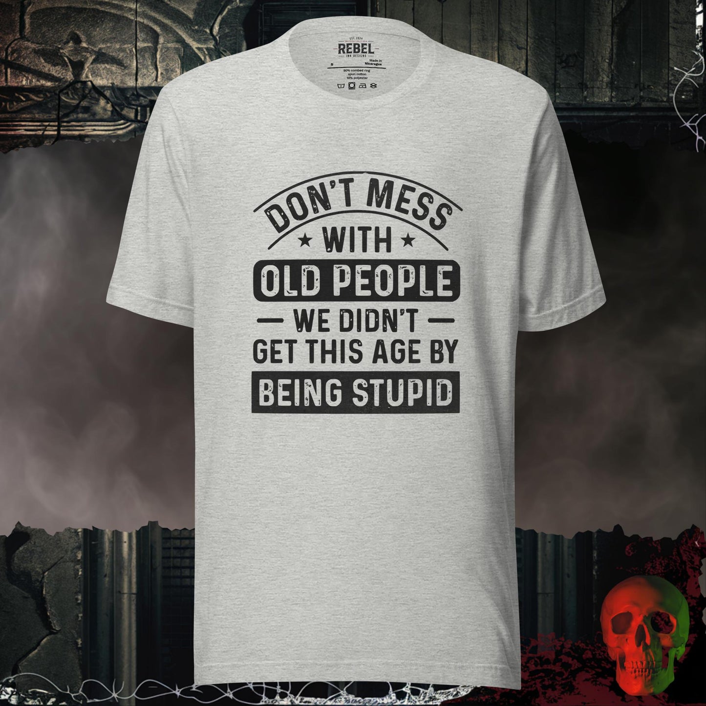 T-shirt featuring bold text that reads “Don’t Mess With Old People — We Didn’t Get This Age By Being Stupid.”
