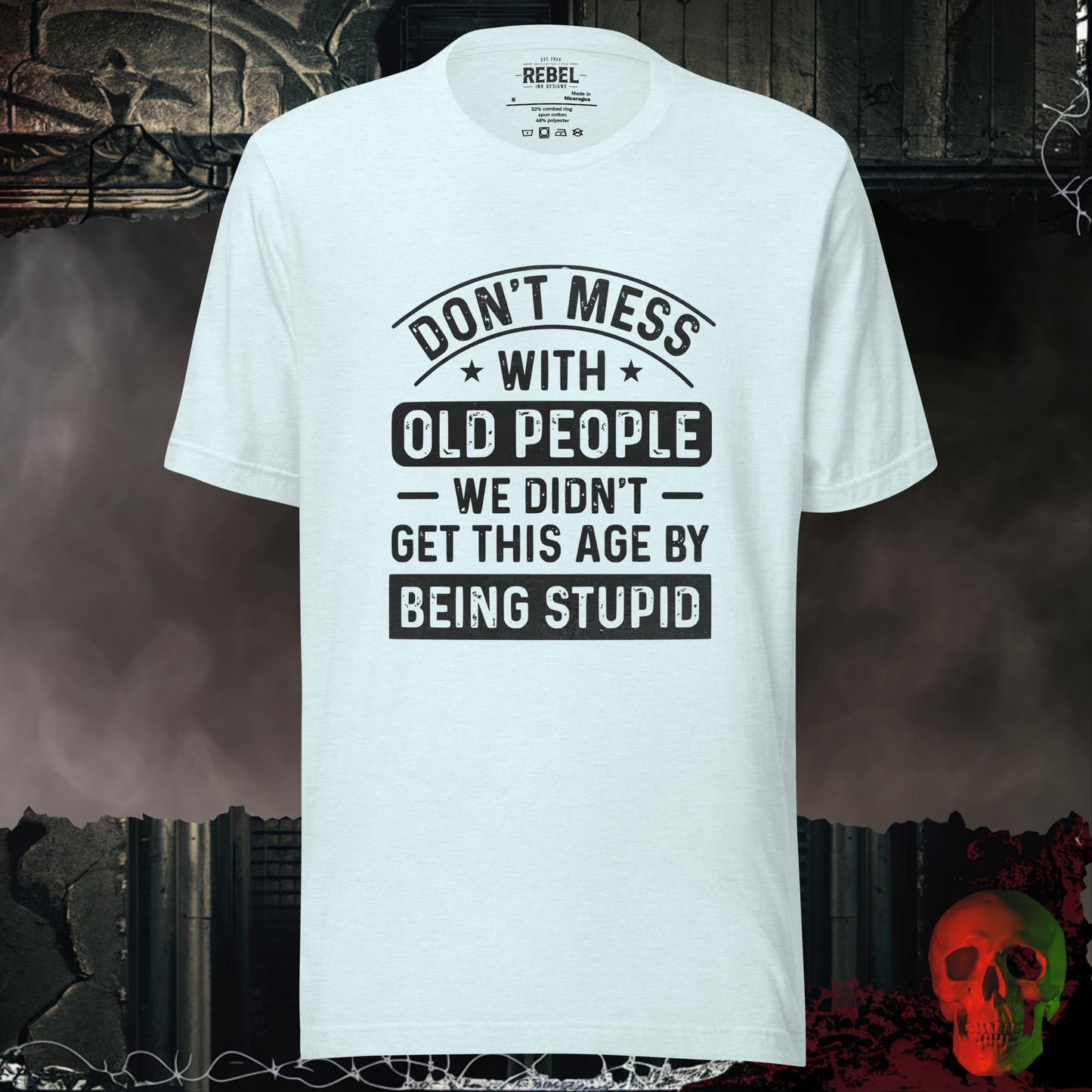 T-shirt featuring bold text that reads “Don’t Mess With Old People — We Didn’t Get This Age By Being Stupid.”