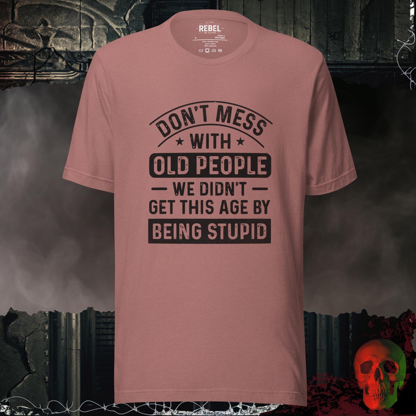 T-shirt featuring bold text that reads “Don’t Mess With Old People — We Didn’t Get This Age By Being Stupid.”