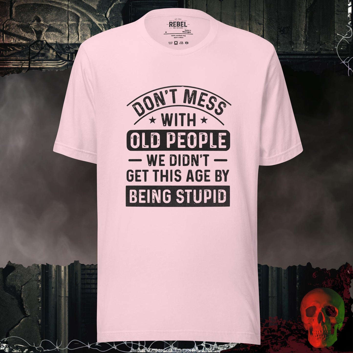 T-shirt featuring bold text that reads “Don’t Mess With Old People — We Didn’t Get This Age By Being Stupid.”
